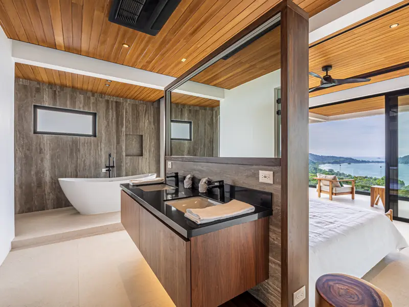 Ensuite bathroom with a soaking tub and an outlook to the bay