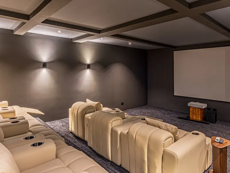 Private cinema with tiered reclining seats