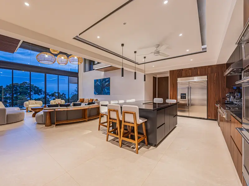 Kitchen island with bar seating open to the living space