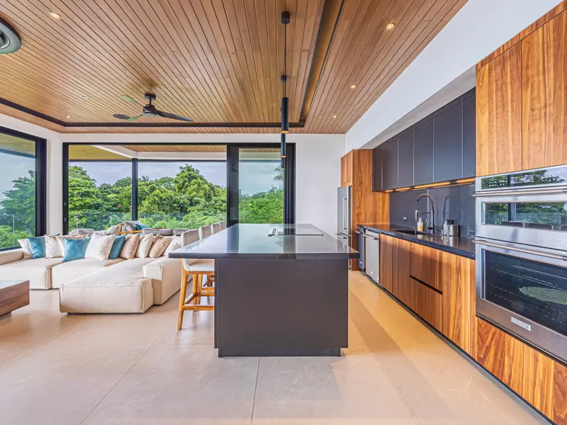 Second kitchen with integrated appliances and island seating