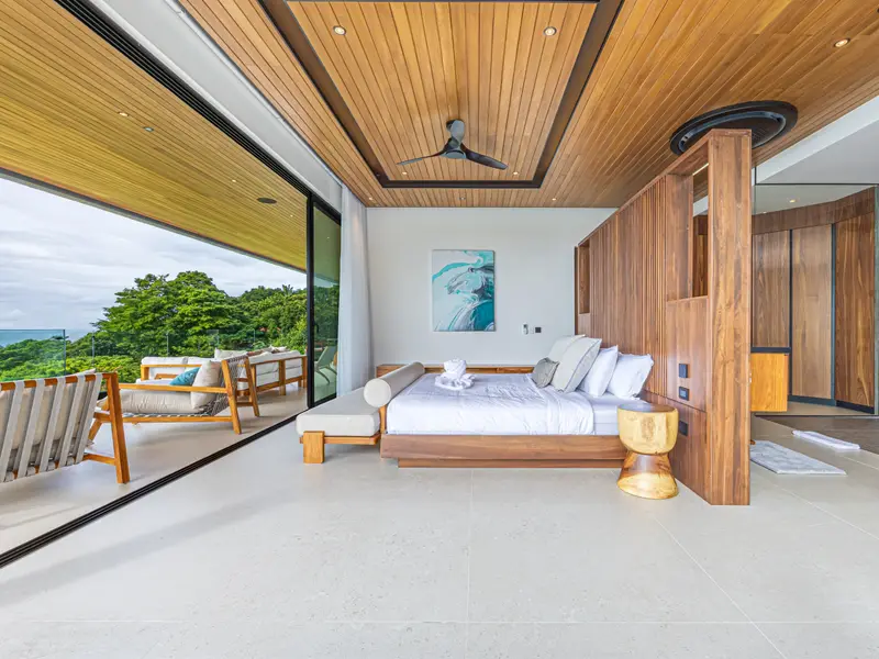 Corner suite with sliding glass opening to the rainforest