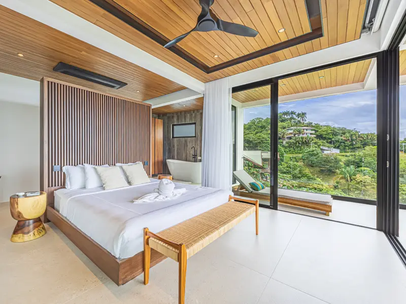 King bedroom looking down the hillside toward the coast