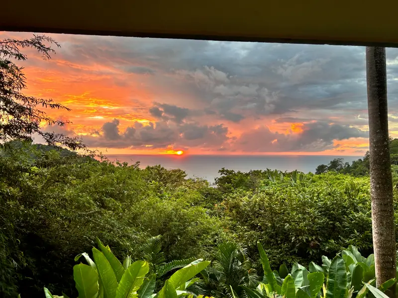 Sunset burning orange over the Pacific from the villa